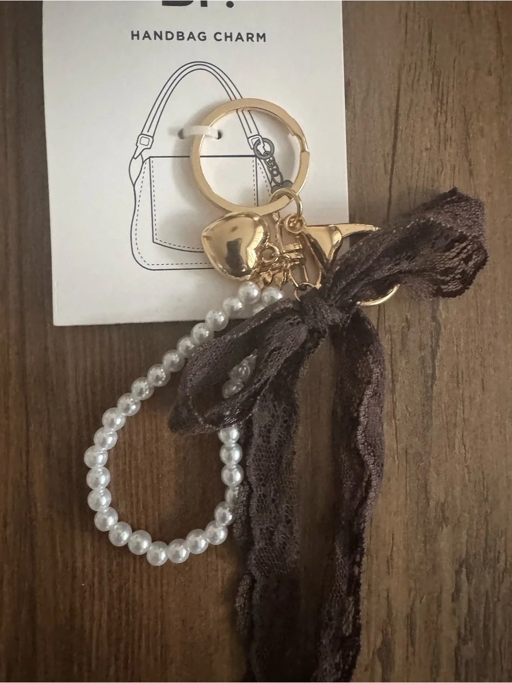 bp Gold Heart Keyring with Pearl Loop & Brown Lace Charm